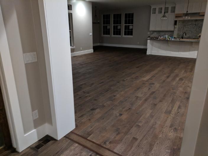 Custom stain with decorative room-dividing feature strip